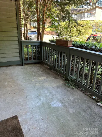 a view of a porch with wooden fence