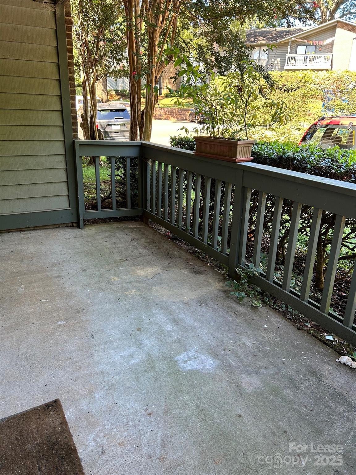 4936 Sardis Road, Unit A Charlotte, NC 28270 - Photo 16 of 21 a view of a porch with wooden fence