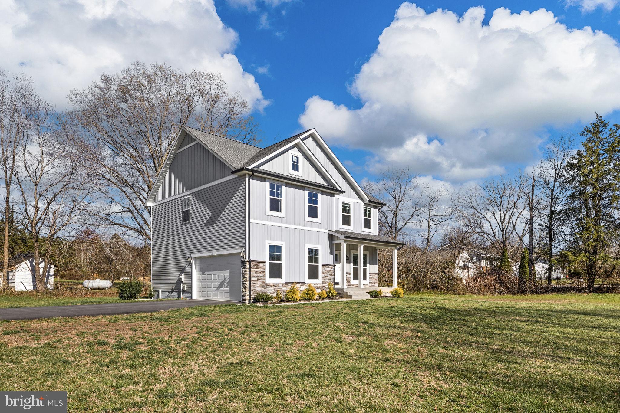 5835 Smith Station Road Fredericksburg, VA 22407 - Photo 1 of 31 a view of a house with a yard