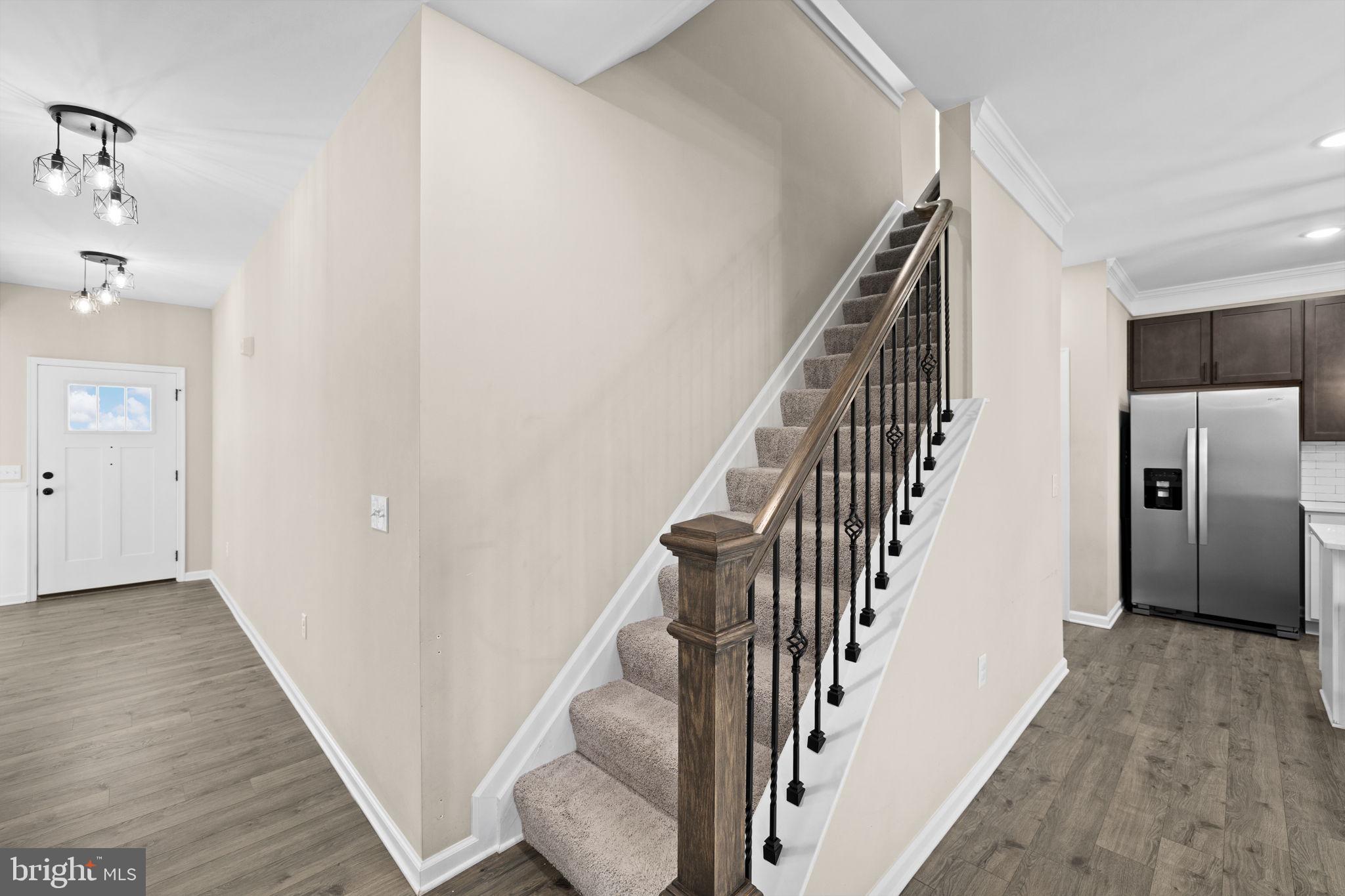 5835 Smith Station Road Fredericksburg, VA 22407 - Photo 11 of 31 a view of a hallway with wooden floor and entryway