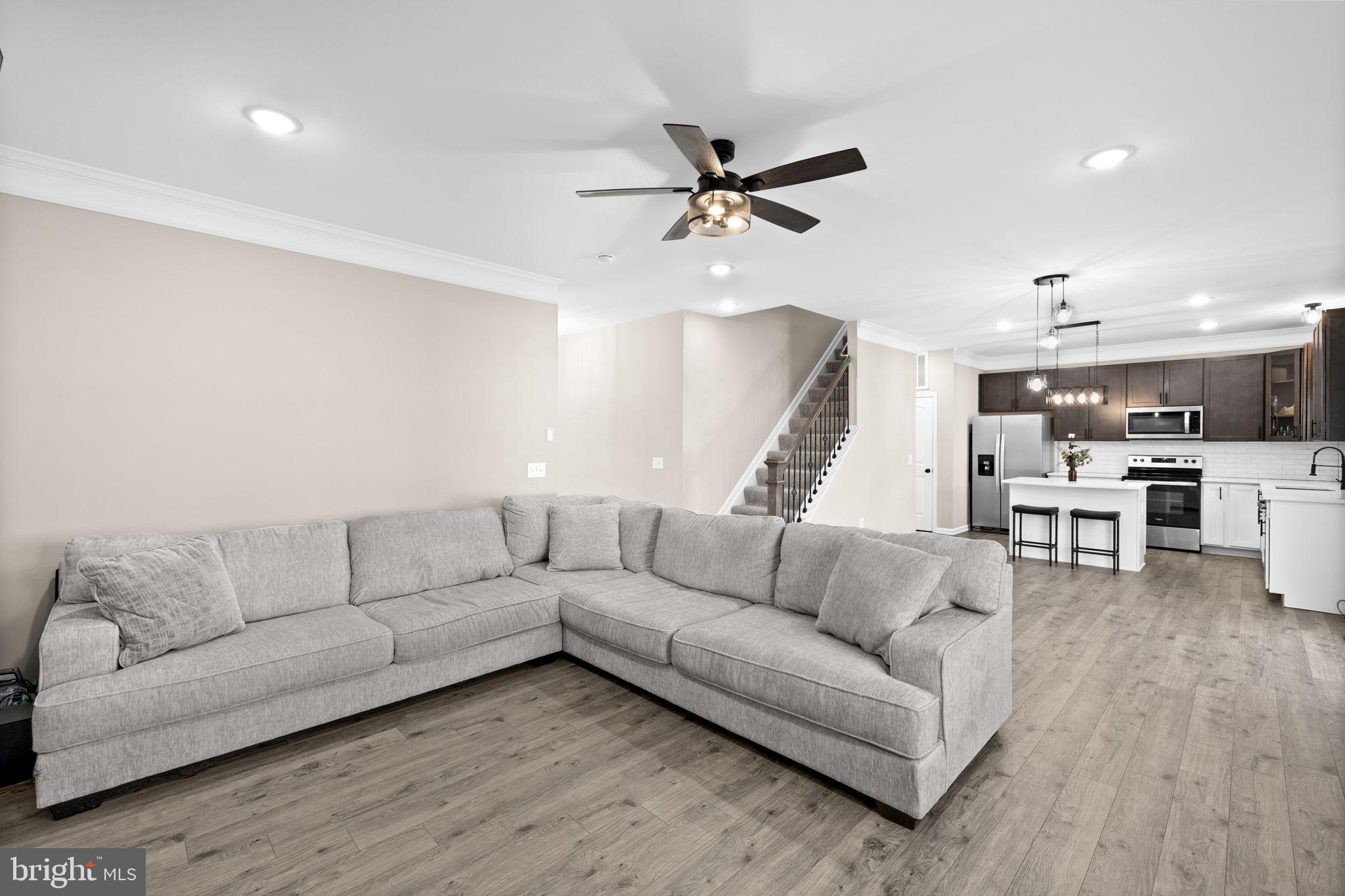 5835 Smith Station Road Fredericksburg, VA 22407 - Photo 14 of 31 a living room with furniture and kitchen view
