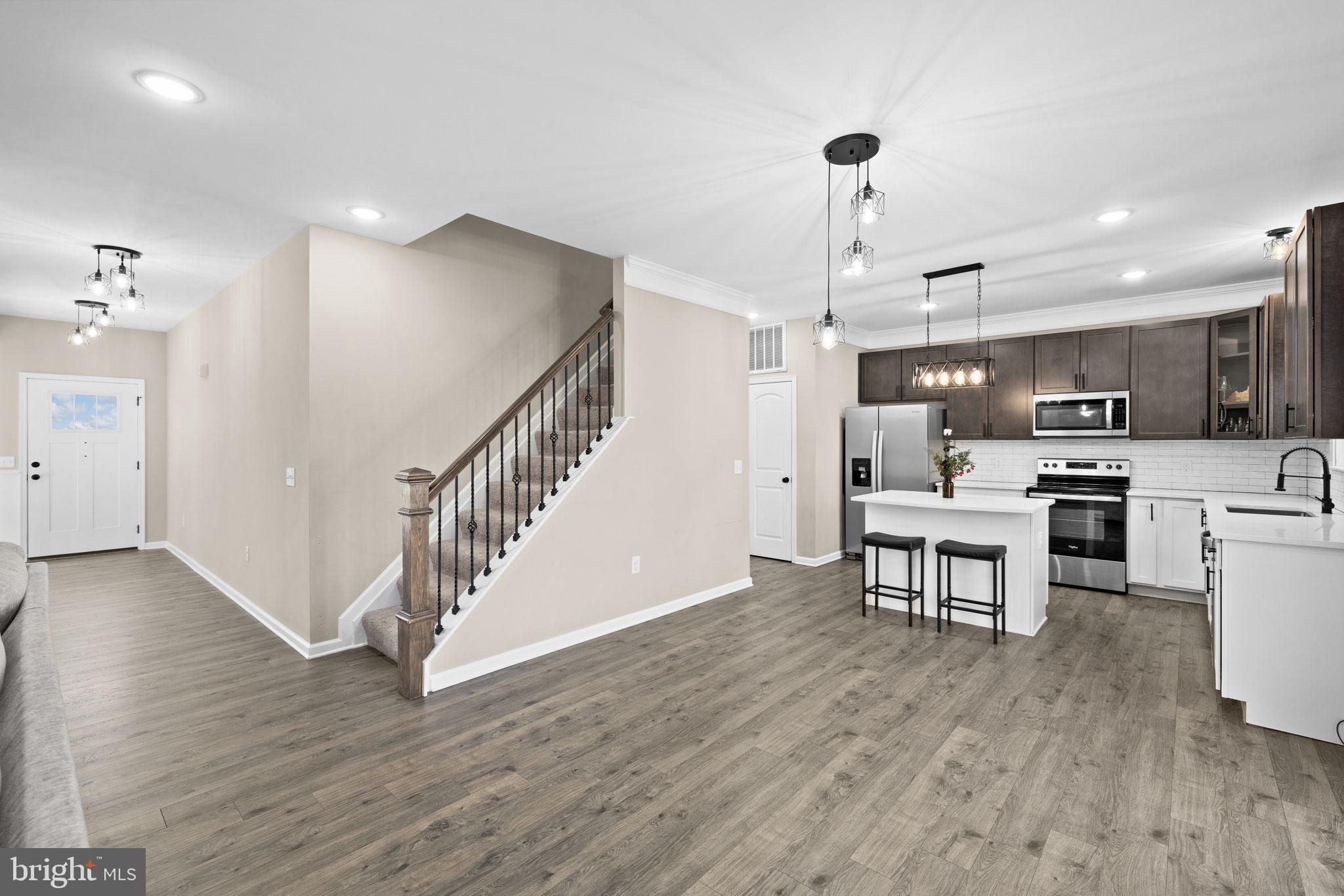5835 Smith Station Road Fredericksburg, VA 22407 - Photo 15 of 31 a view of kitchen with cabinets and wooden floor