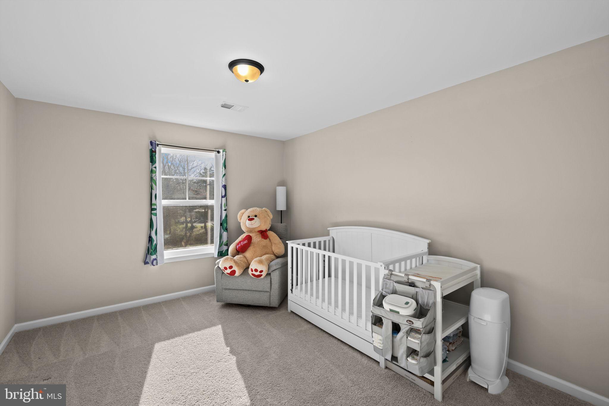 5835 Smith Station Road Fredericksburg, VA 22407 - Photo 24 of 31 a bedroom with a bed and a window