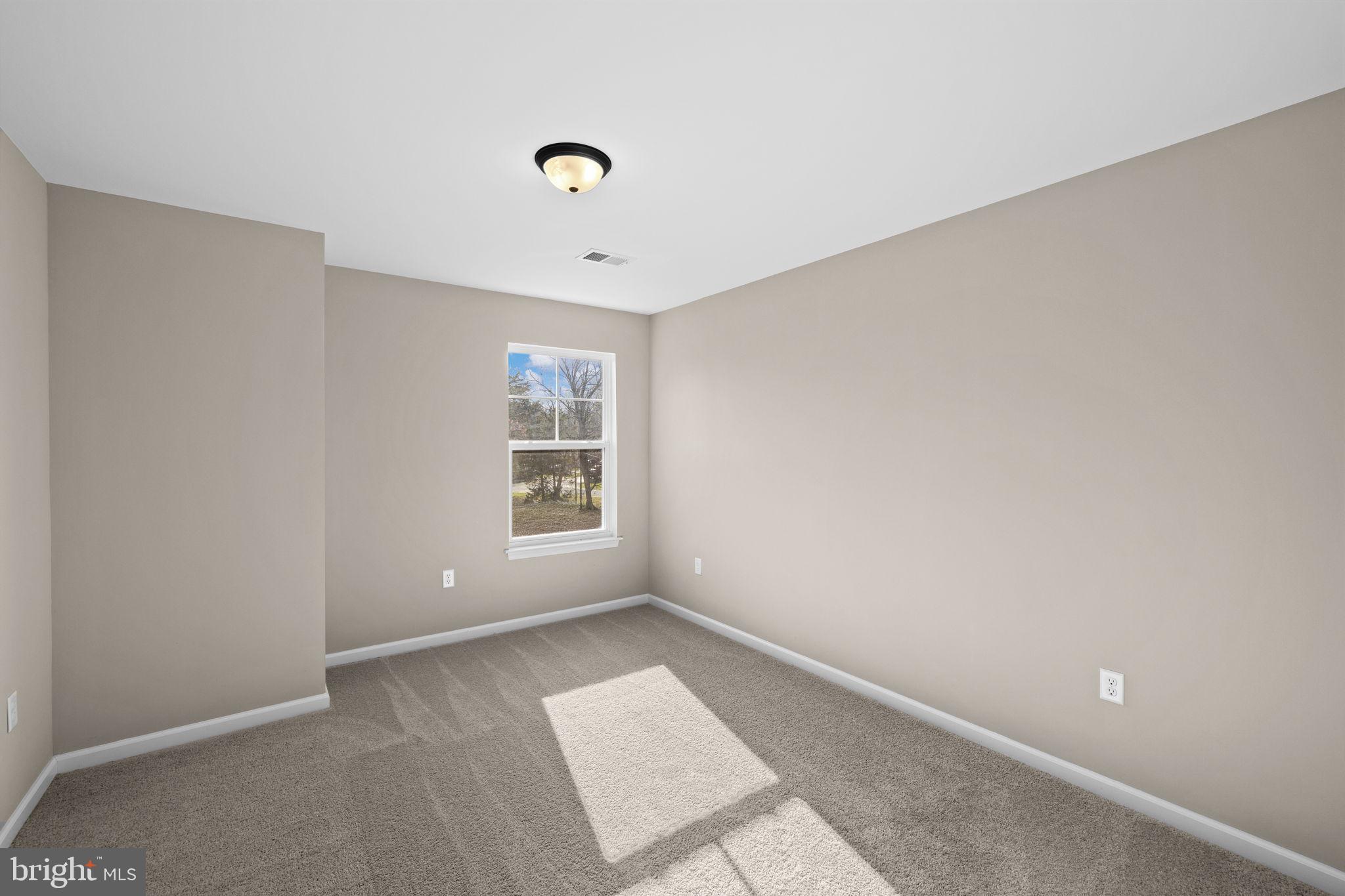 5835 Smith Station Road Fredericksburg, VA 22407 - Photo 26 of 31 an empty room with windows