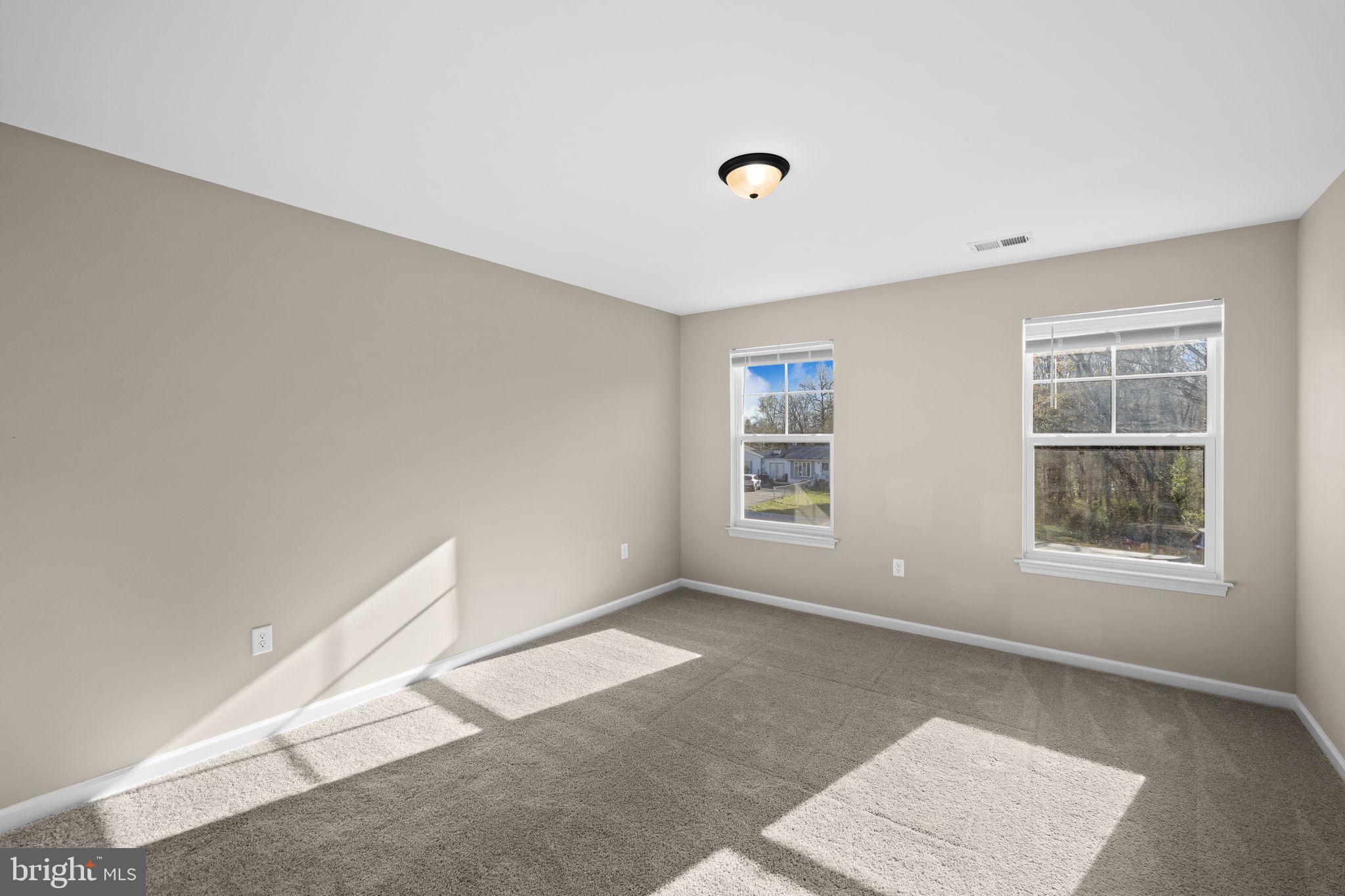 5835 Smith Station Road Fredericksburg, VA 22407 - Photo 27 of 31 an empty room with windows