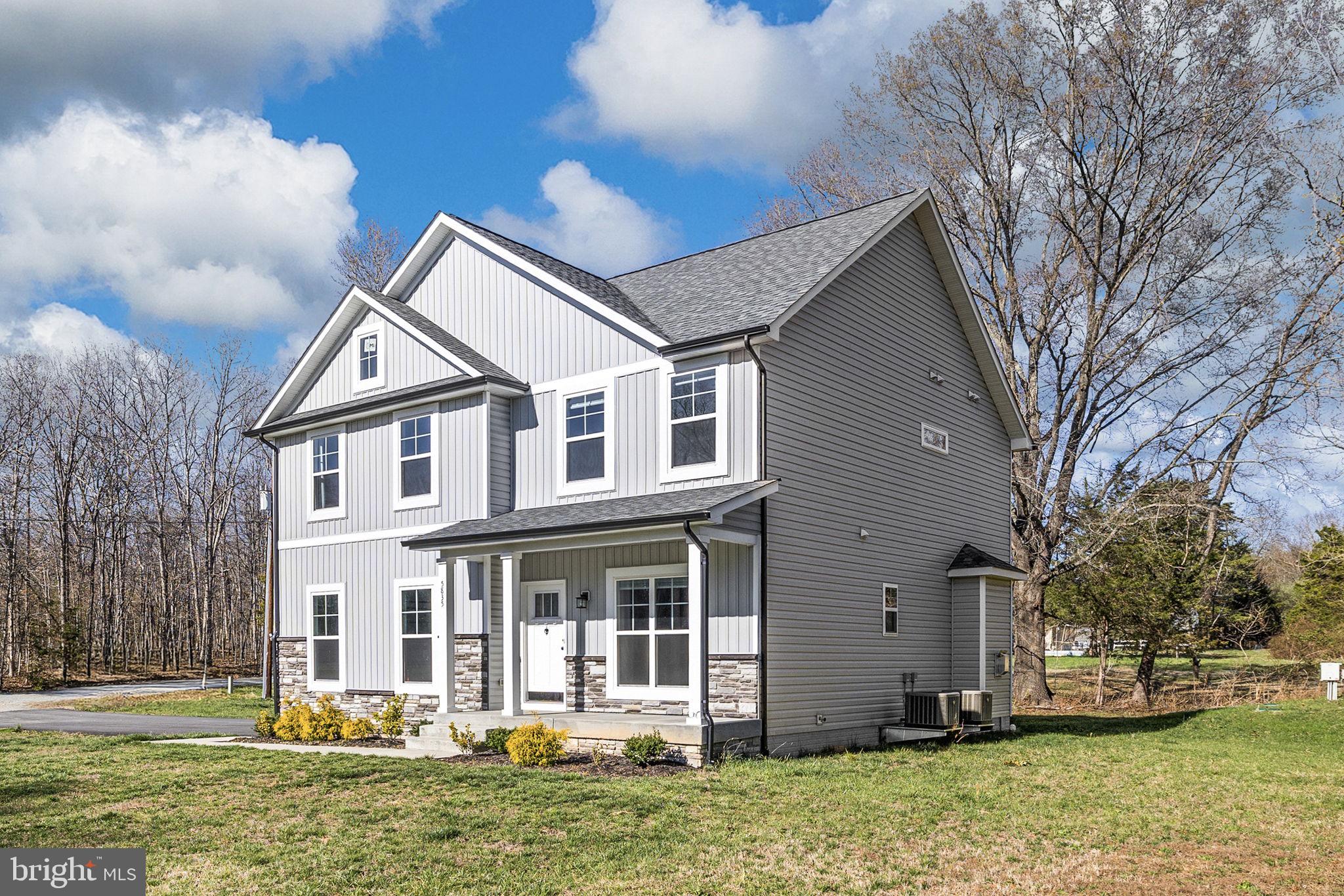 5835 Smith Station Road Fredericksburg, VA 22407 - Photo 29 of 31 a front view of a house with a yard