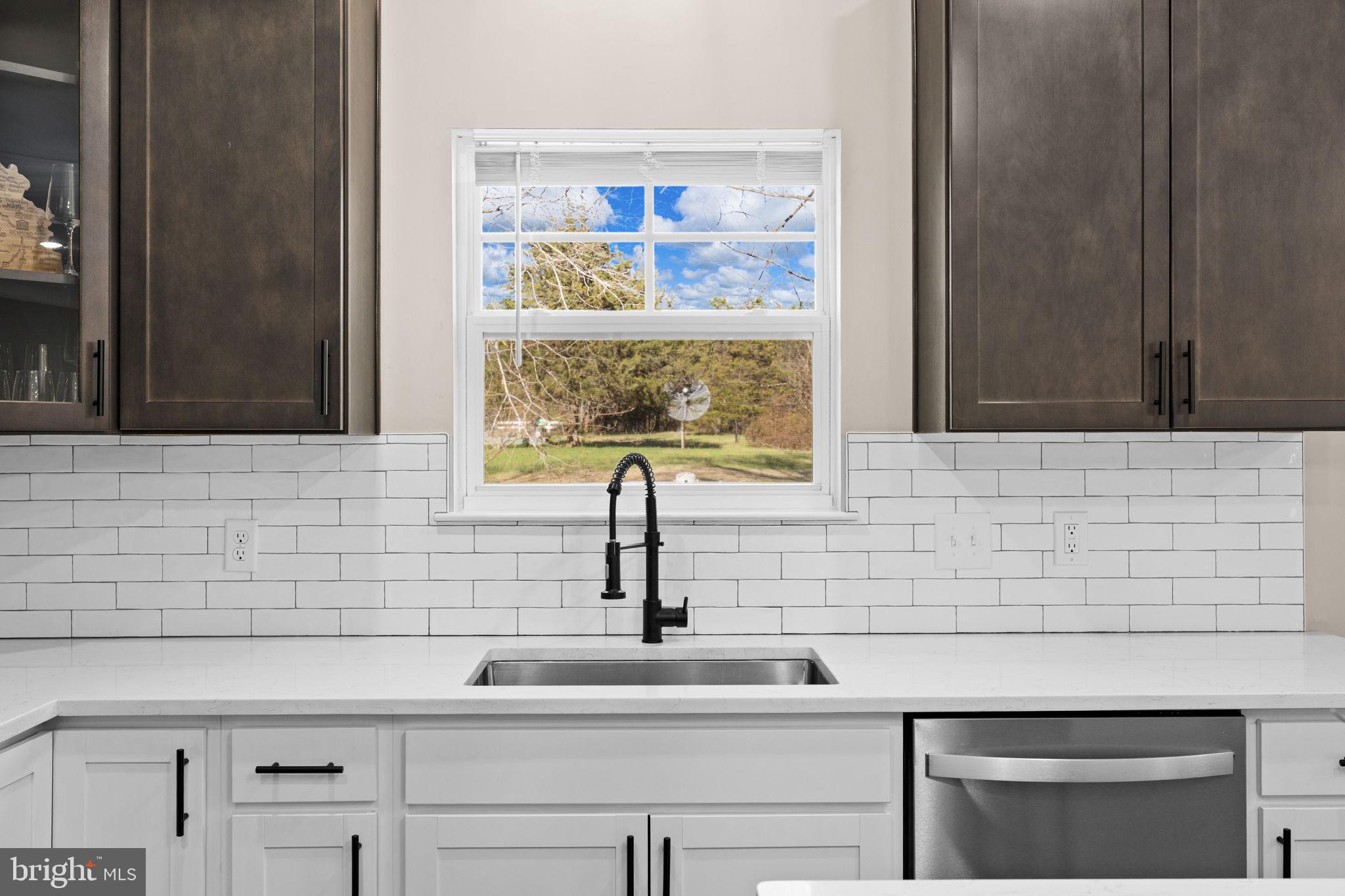 5835 Smith Station Road Fredericksburg, VA 22407 - Photo 6 of 31 a bathroom with a sink and a window
