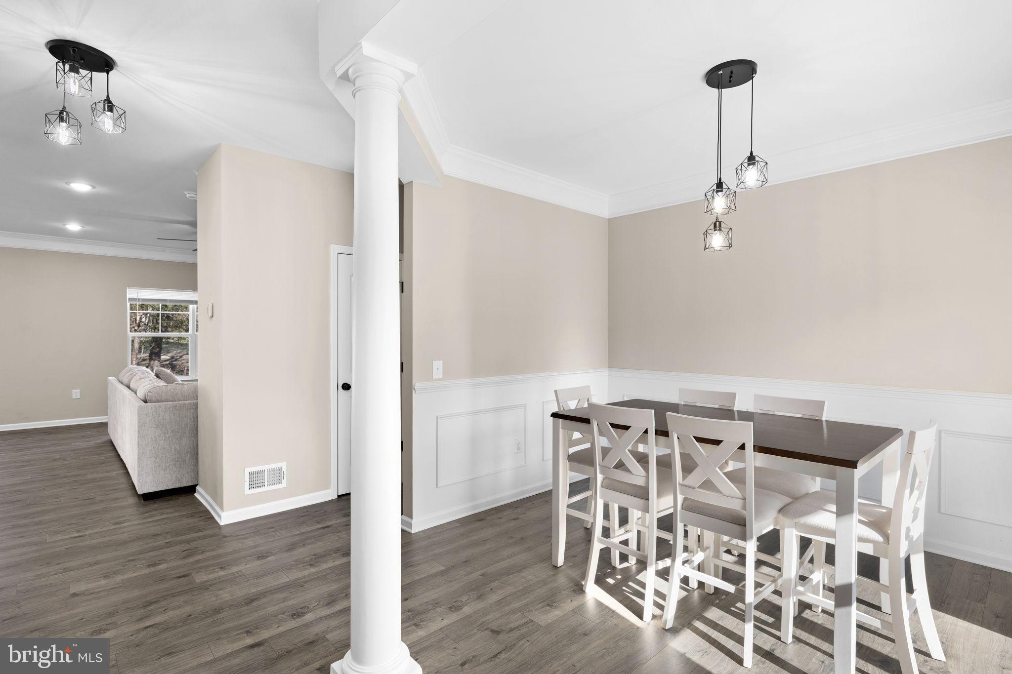 5835 Smith Station Road Fredericksburg, VA 22407 - Photo 10 of 31 a view of a dining room with furniture and wooden floor