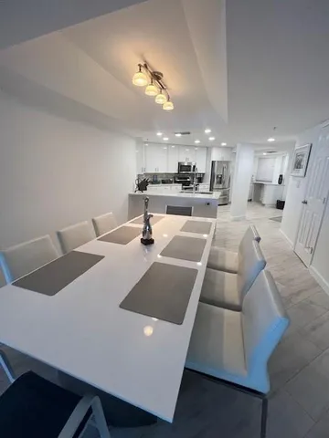 a view of a dining area with furniture and wooden floor