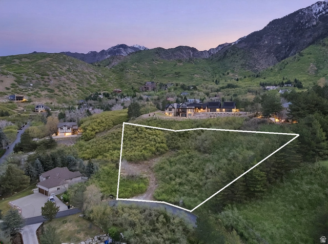 10667 Hidden Ridge Lane Sandy, UT 84092 - Photo 2 of 21 Aerial overview of property's location with a mountain backdrop and property parcel outlined