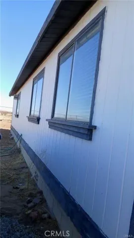 a view of balcony with wooden floor