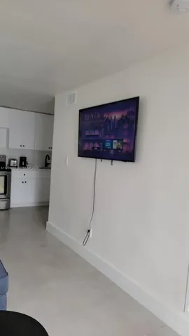 a view of a kitchen with wooden floor