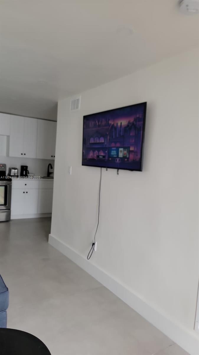 2820 Southwest 13th Street, Unit 4 Miami, FL 33145 - Photo 15 of 17 a view of a kitchen with wooden floor