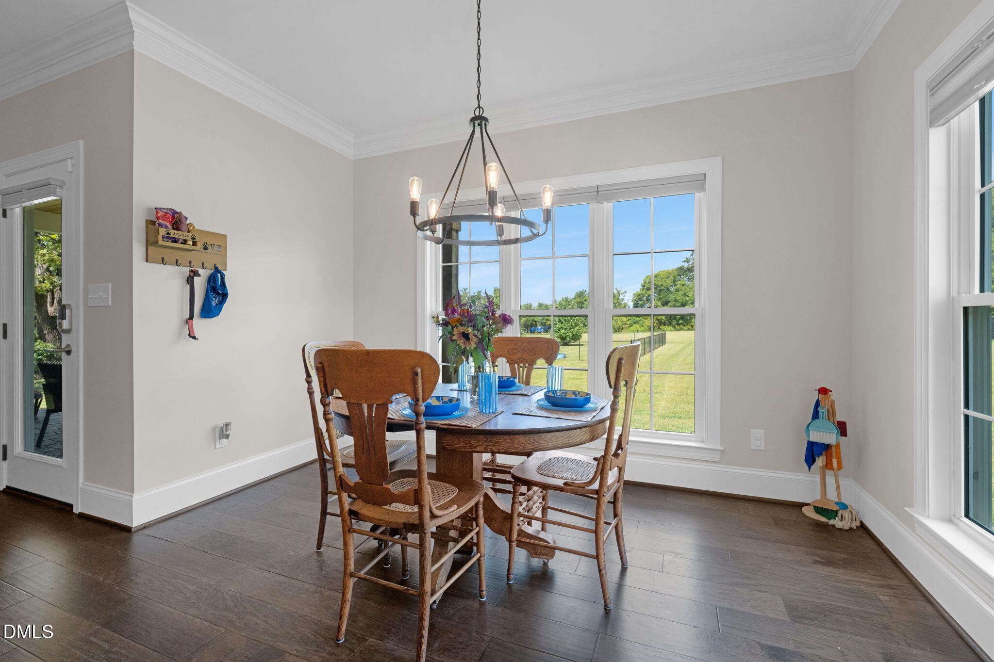 106 Garrison Farm Road Mebane, NC 27302 - Photo 15 of 46 a view of a dining room with furniture window and wooden floor