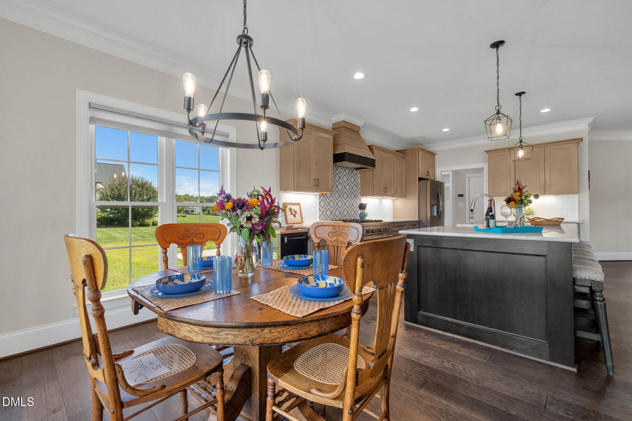 106 Garrison Farm Road Mebane, NC 27302 - Photo 16 of 46 a view of a dining room with furniture window and wooden floor