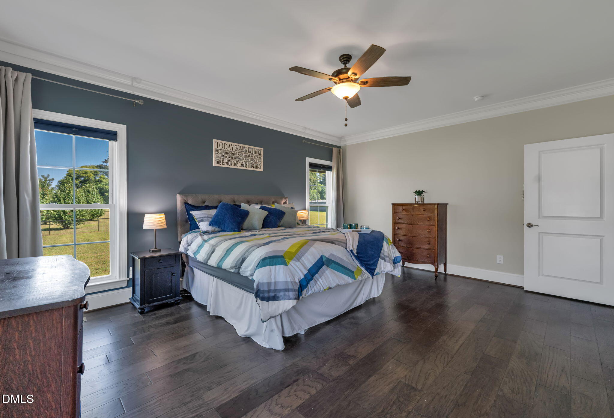 106 Garrison Farm Road Mebane, NC 27302 - Photo 18 of 46 a bedroom with a bed and a chandelier