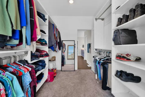 a utility room with cabinets washer and dryer
