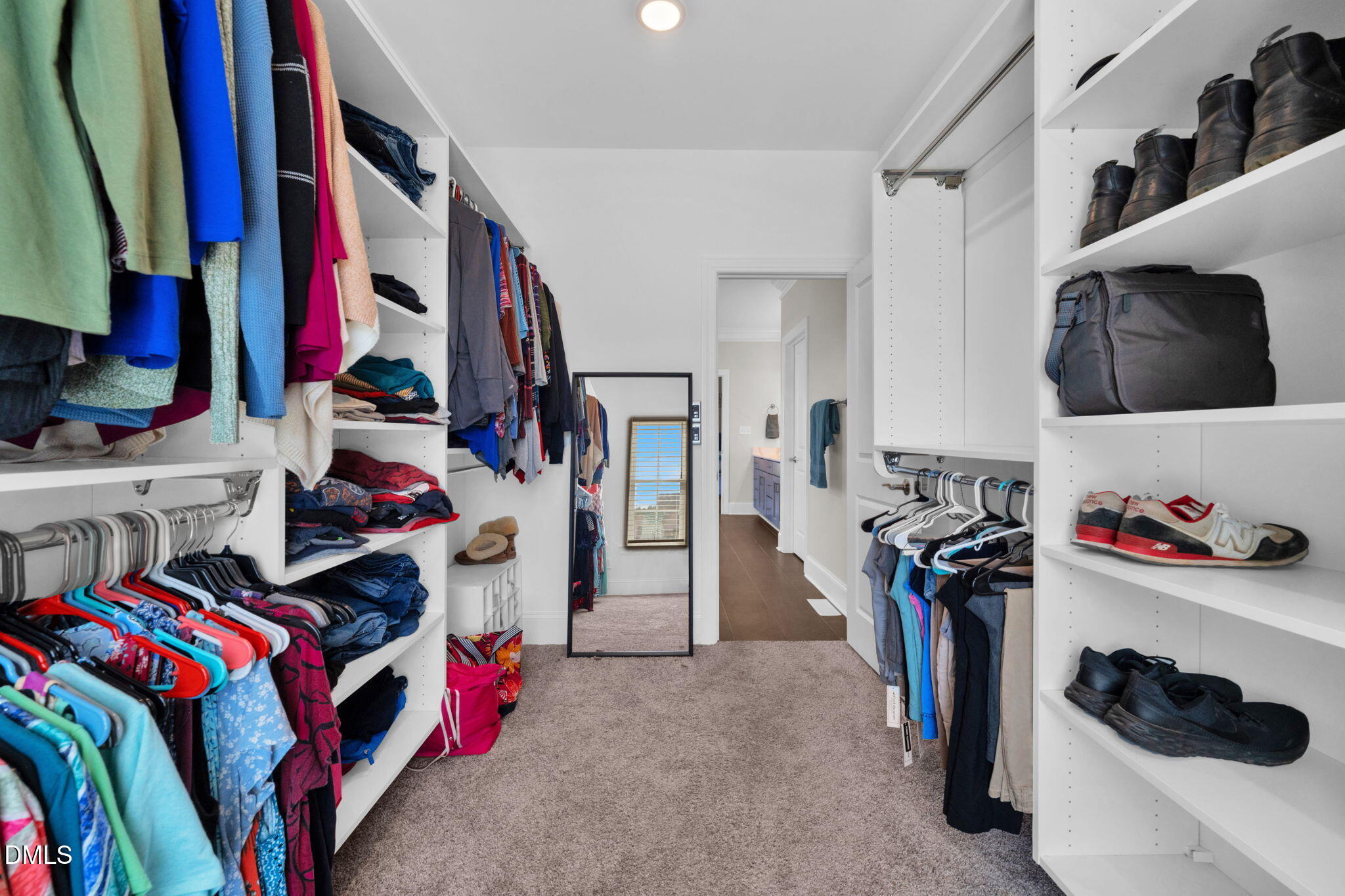 106 Garrison Farm Road Mebane, NC 27302 - Photo 22 of 46 a view of walk in closet with clothes and shoes