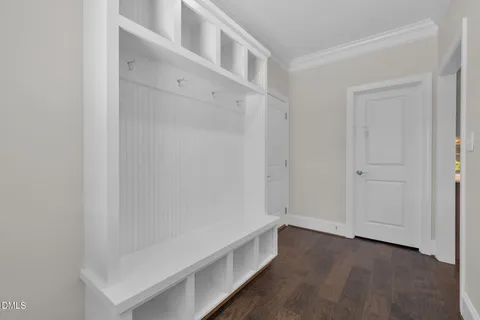 a bathroom with a sink mirror and toilet