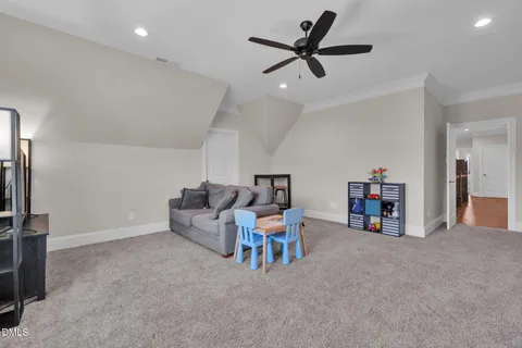 a bedroom with furniture and a large window