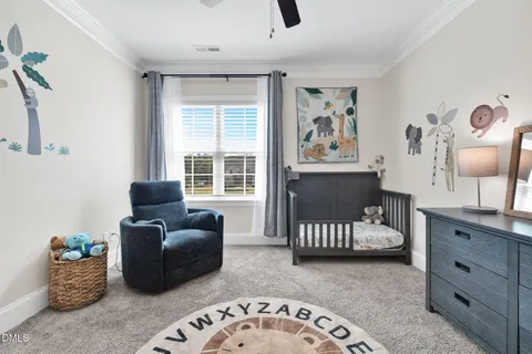 a bed room with a bed and a television