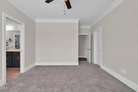 a bedroom with bed and a chandelier