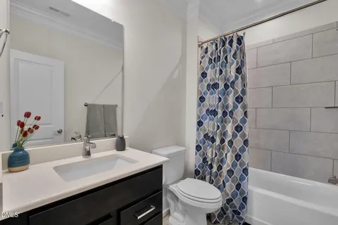 a view of a dining room with furniture and window