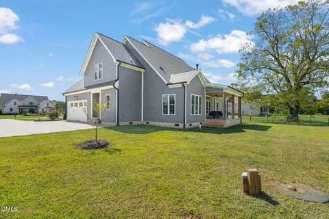 a view of a swimming pool with a yard