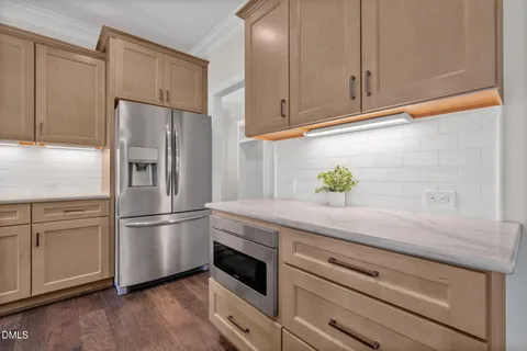 a kitchen with stainless steel appliances granite countertop lots of counter top space