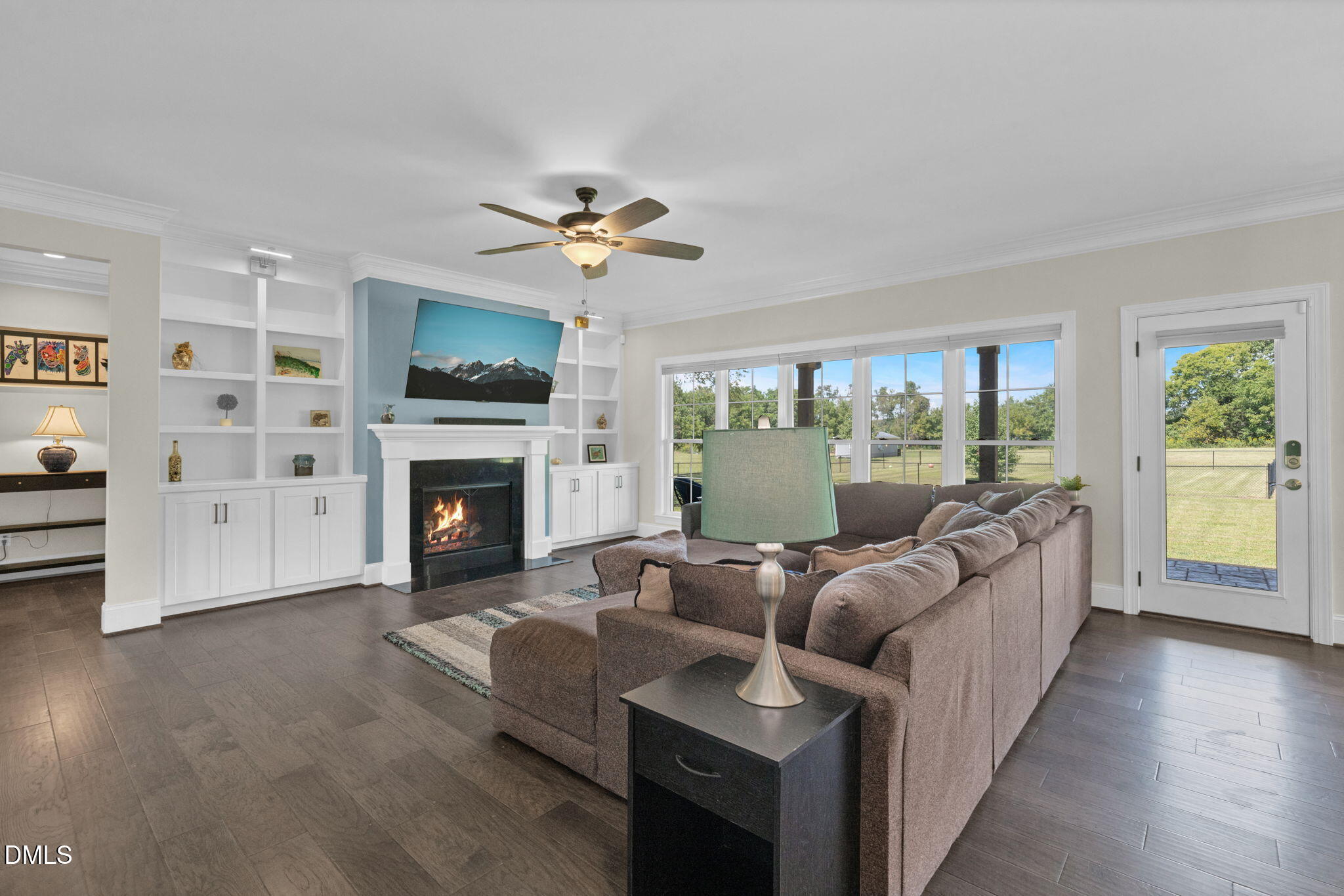 106 Garrison Farm Road Mebane, NC 27302 - Photo 9 of 46 a living room with furniture a fireplace and a flat screen tv