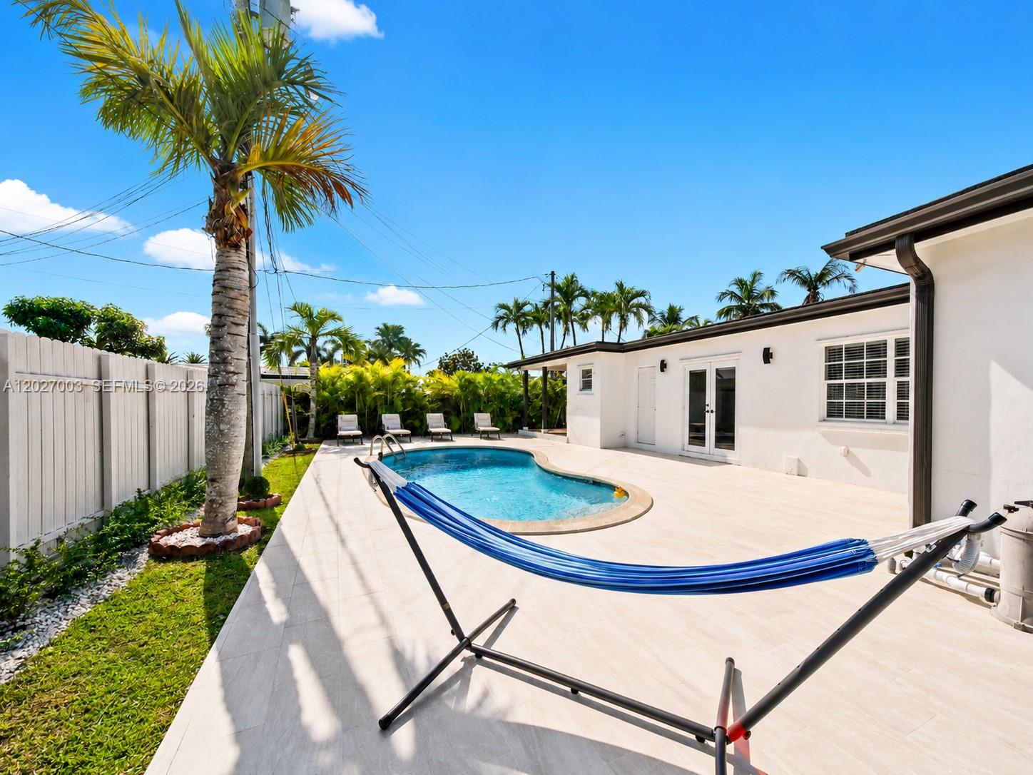 2761 Southwest 92nd Place Miami, FL 33165 - Photo 24 of 37 a view of swimming pool with a patio