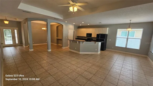 a view of a kitchen with furniture and a window