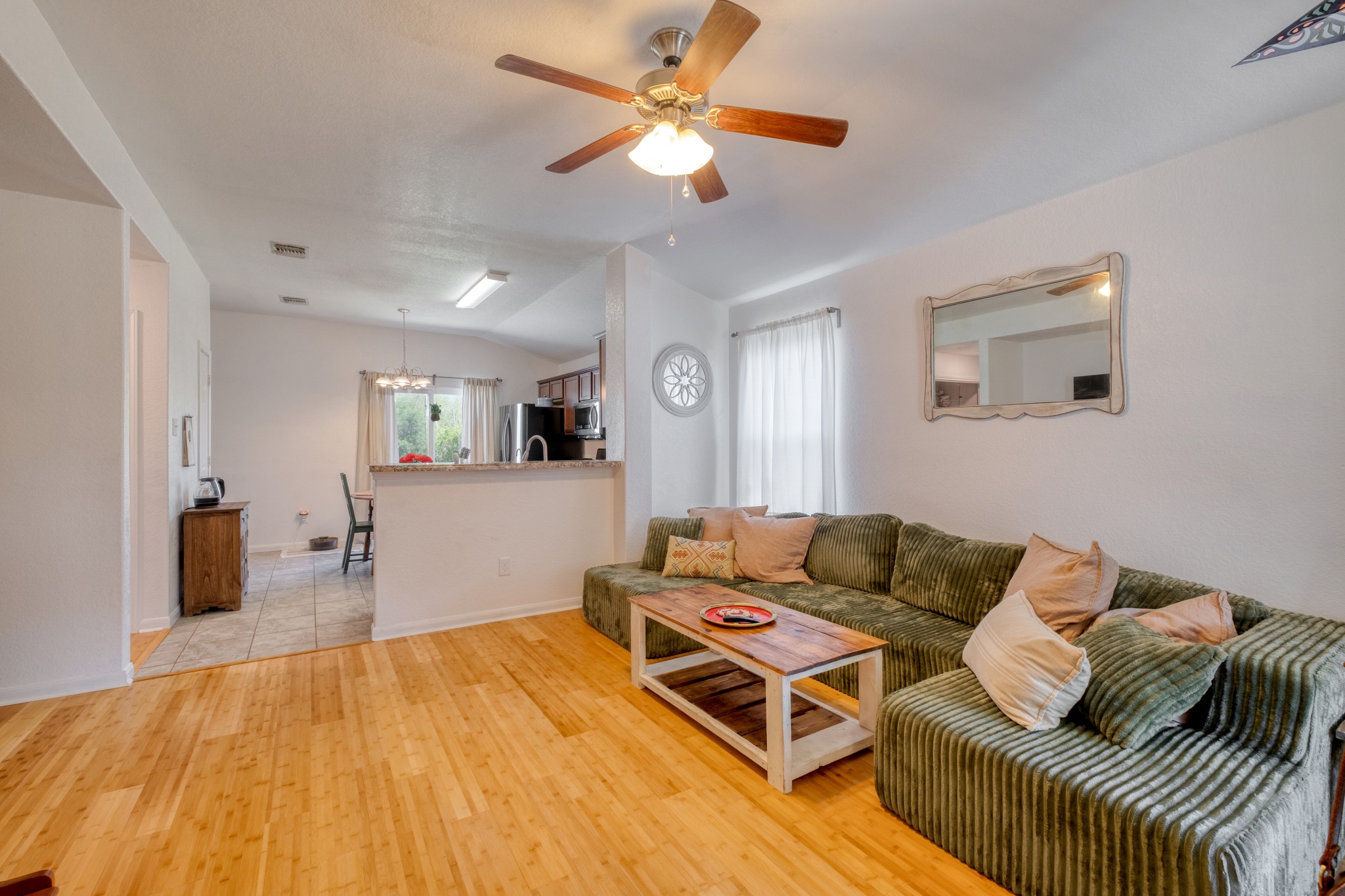 174 Falcon Drive Luling, TX 78648 - Photo 4 of 37 a living room with furniture and a wooden floor