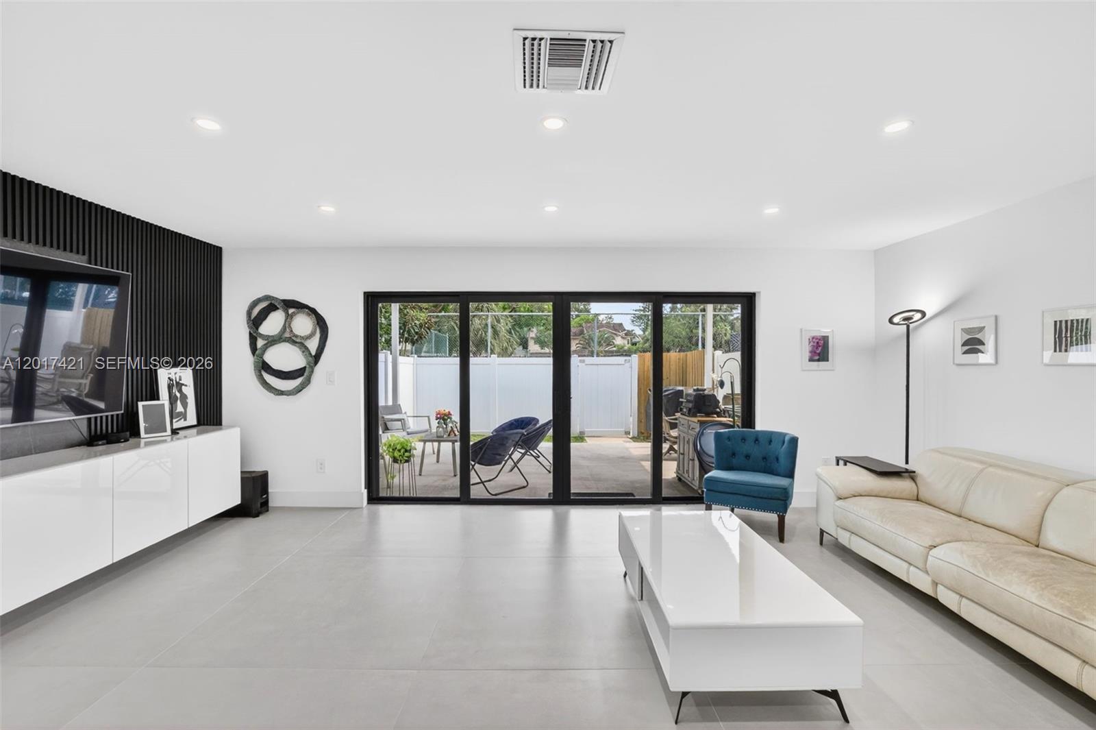 3848 Atlanta Street Hollywood, FL 33021 - Photo 29 of 79 Oversized family room / great room (room for dining area as well (just move sofa closer to TV and add it behind)