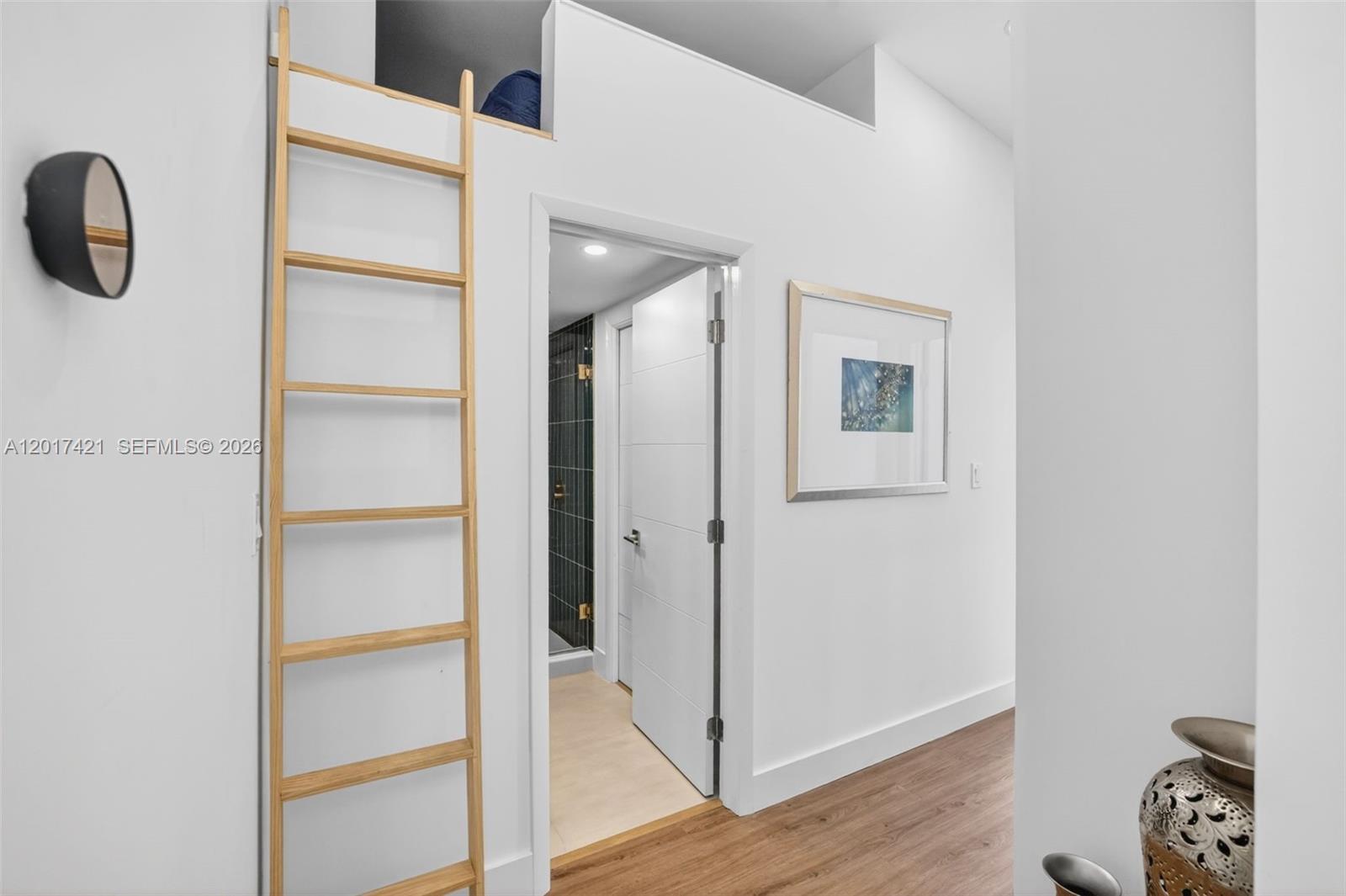 3848 Atlanta Street Hollywood, FL 33021 - Photo 43 of 79 stairs to extra storage area, loft or hideaway space. View toward upstairs guest bathroom