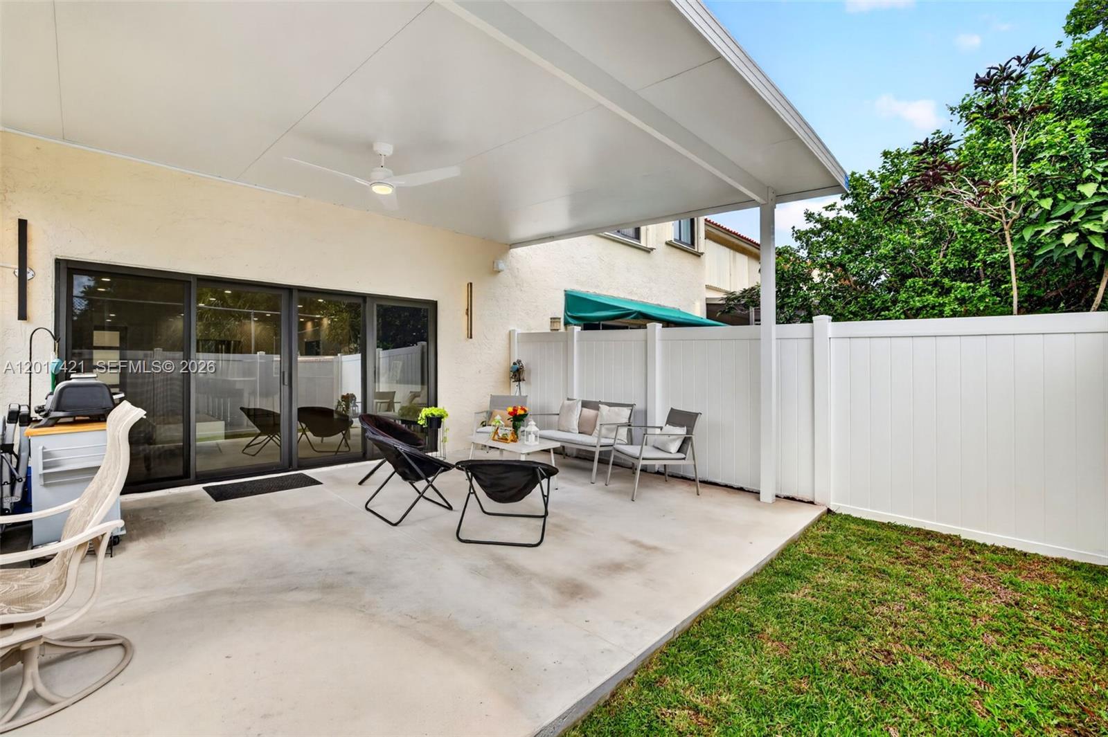 3848 Atlanta Street Hollywood, FL 33021 - Photo 57 of 79 Fabulous backyard w/ new concrete pad and covered shade structure w/ fan to enjoy the backyard and weather