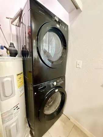 a close view of a utility room with dryer and washer