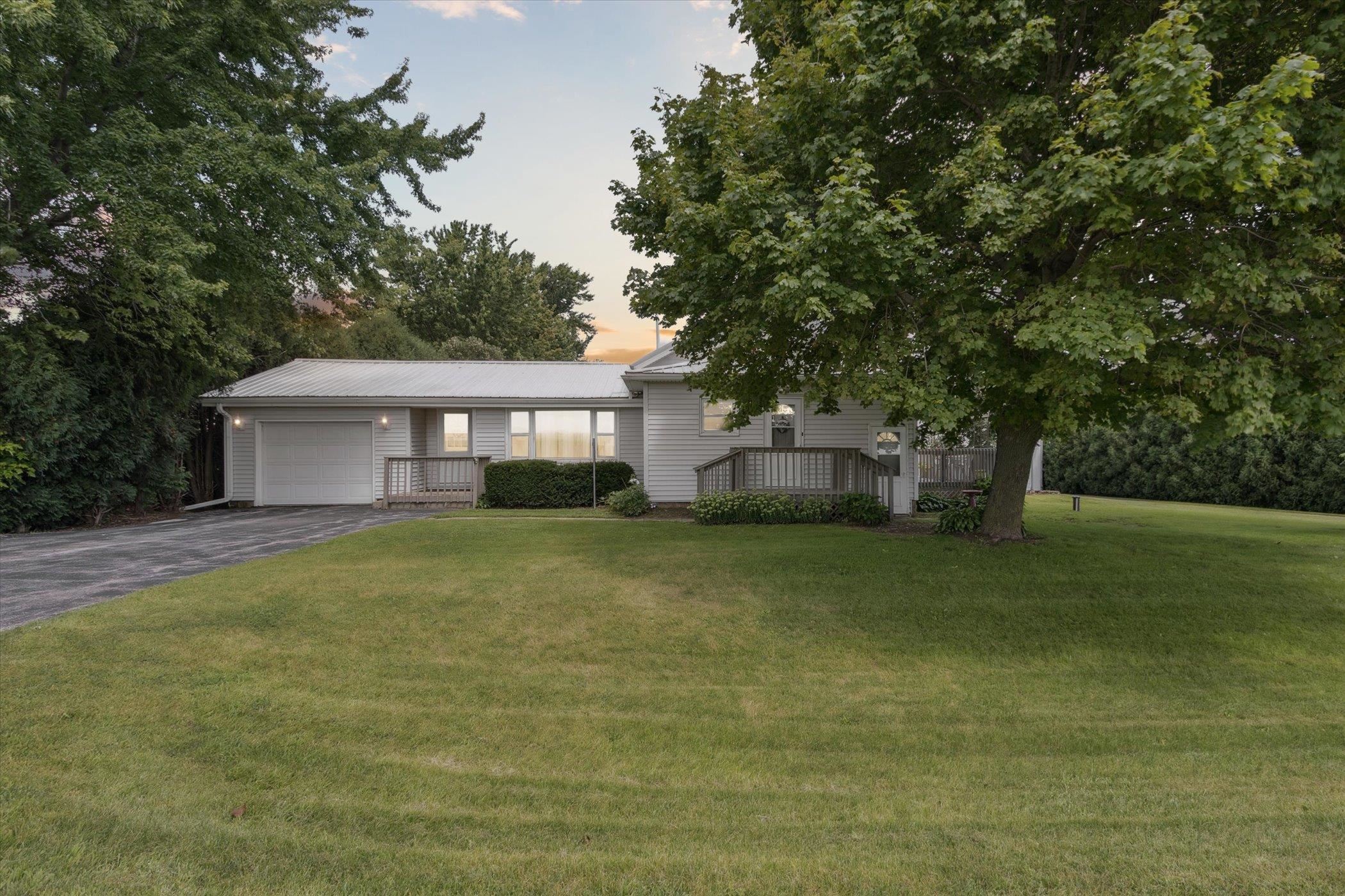 976 East Cedarville Road Freeport, IL 61032 - Photo 1 of 48 a view of a house with a backyard