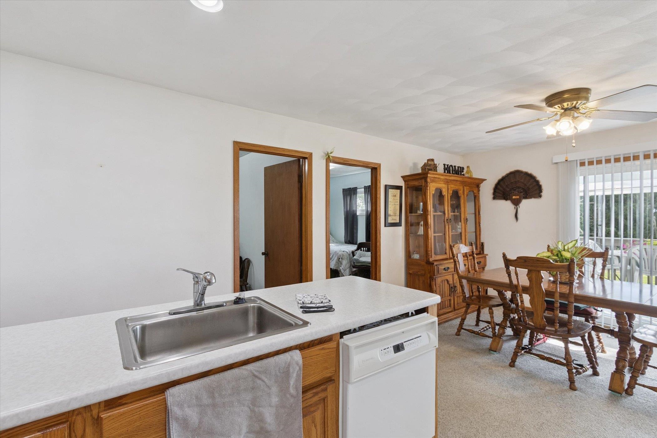 976 East Cedarville Road Freeport, IL 61032 - Photo 14 of 48 a kitchen with a stove a sink and a refrigerator