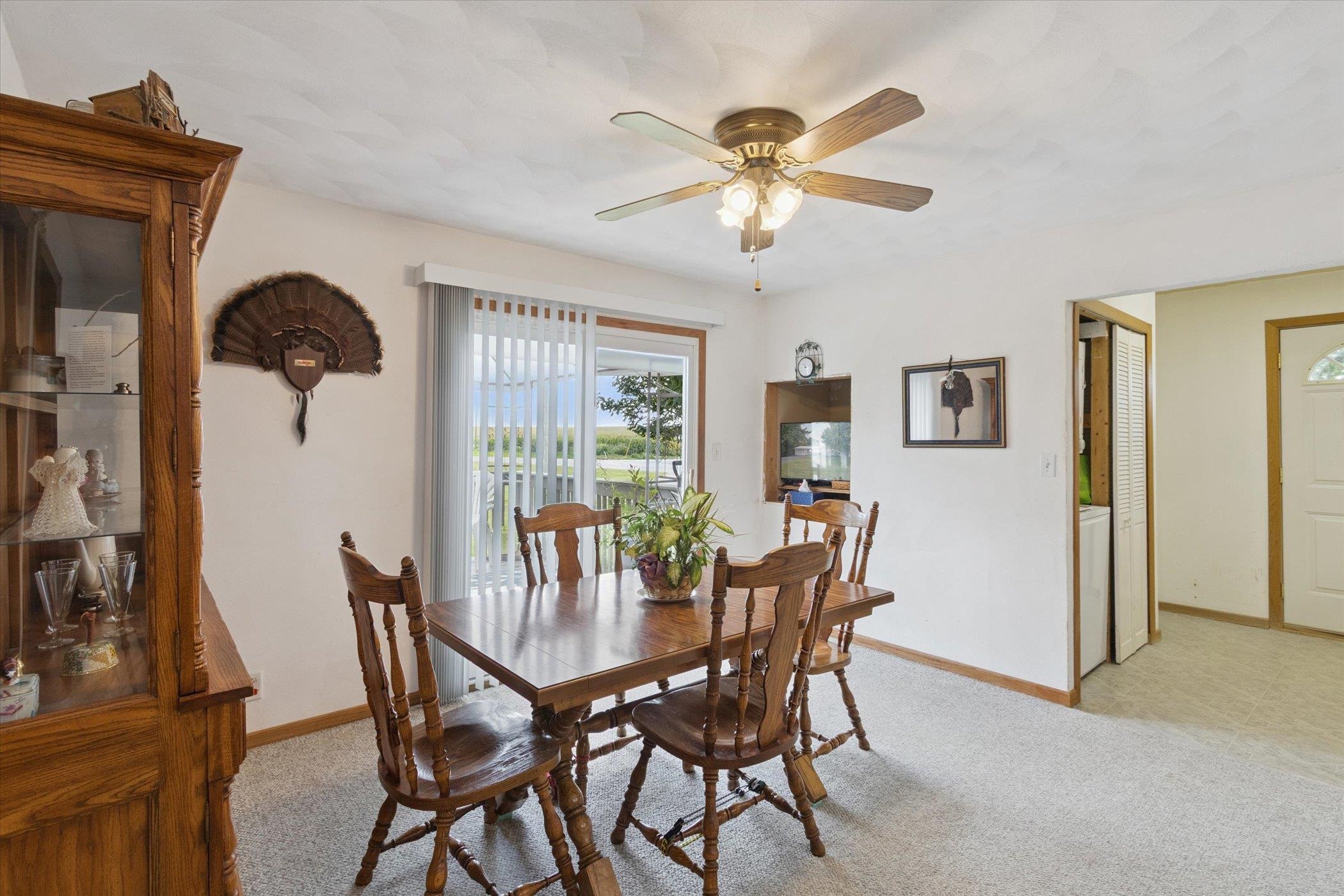 976 East Cedarville Road Freeport, IL 61032 - Photo 16 of 48 a view of a dining room with furniture and a chandelier