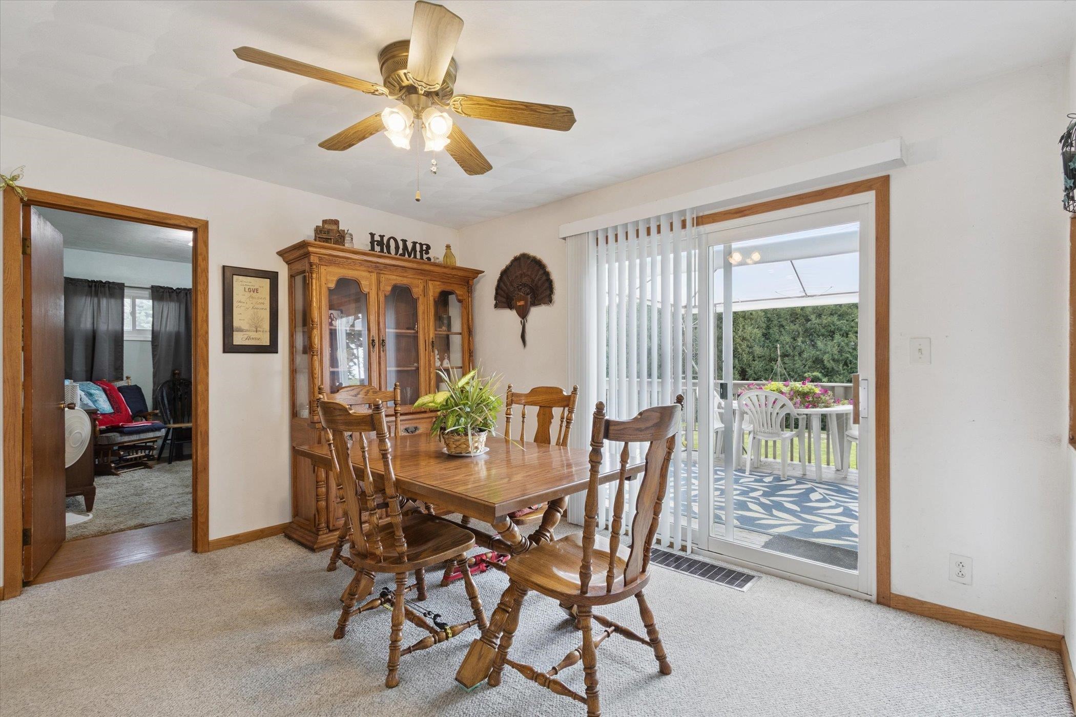 976 East Cedarville Road Freeport, IL 61032 - Photo 19 of 48 a view of a dining room with furniture and chandelier