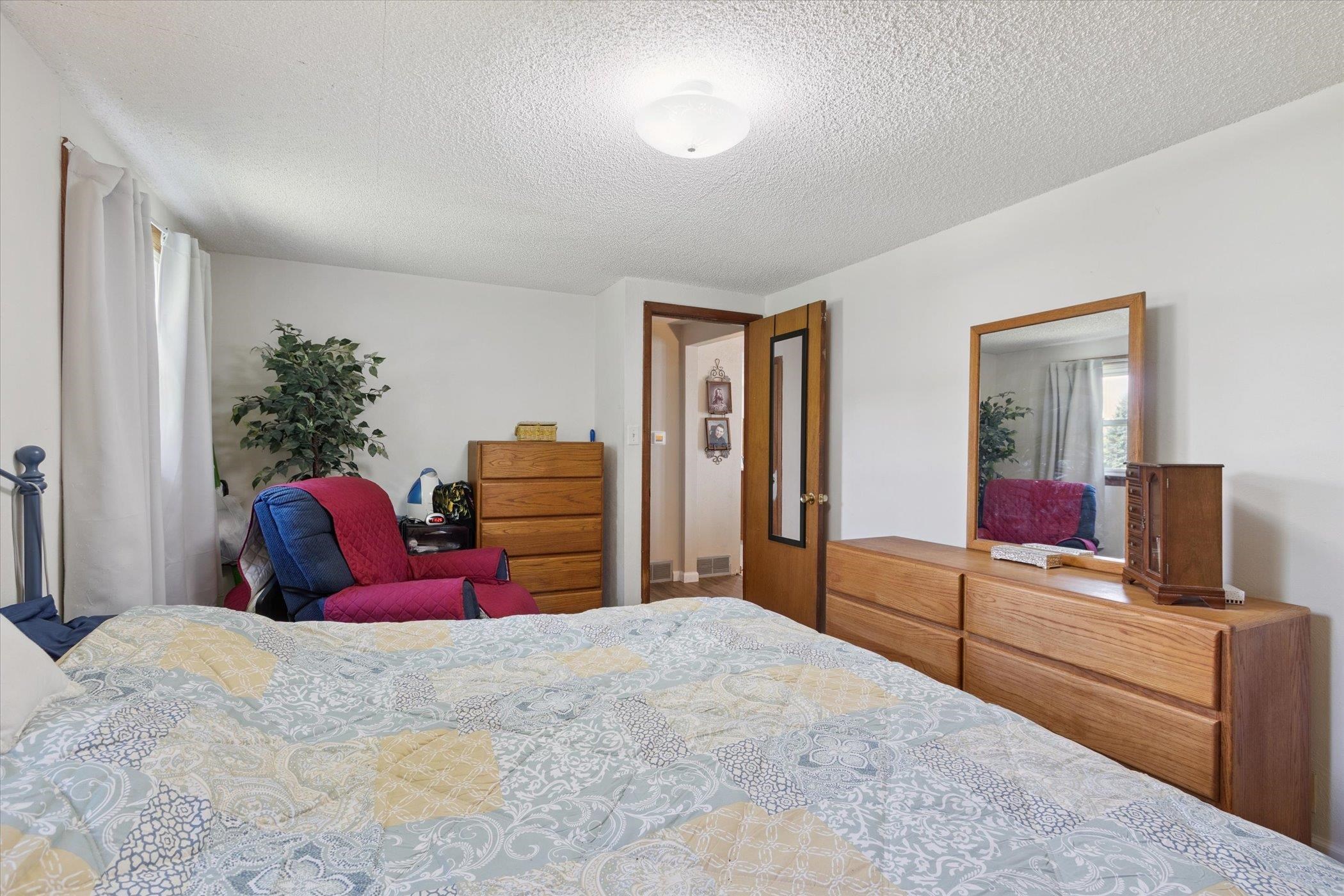 976 East Cedarville Road Freeport, IL 61032 - Photo 21 of 48 a bedroom with bed and wooden floor