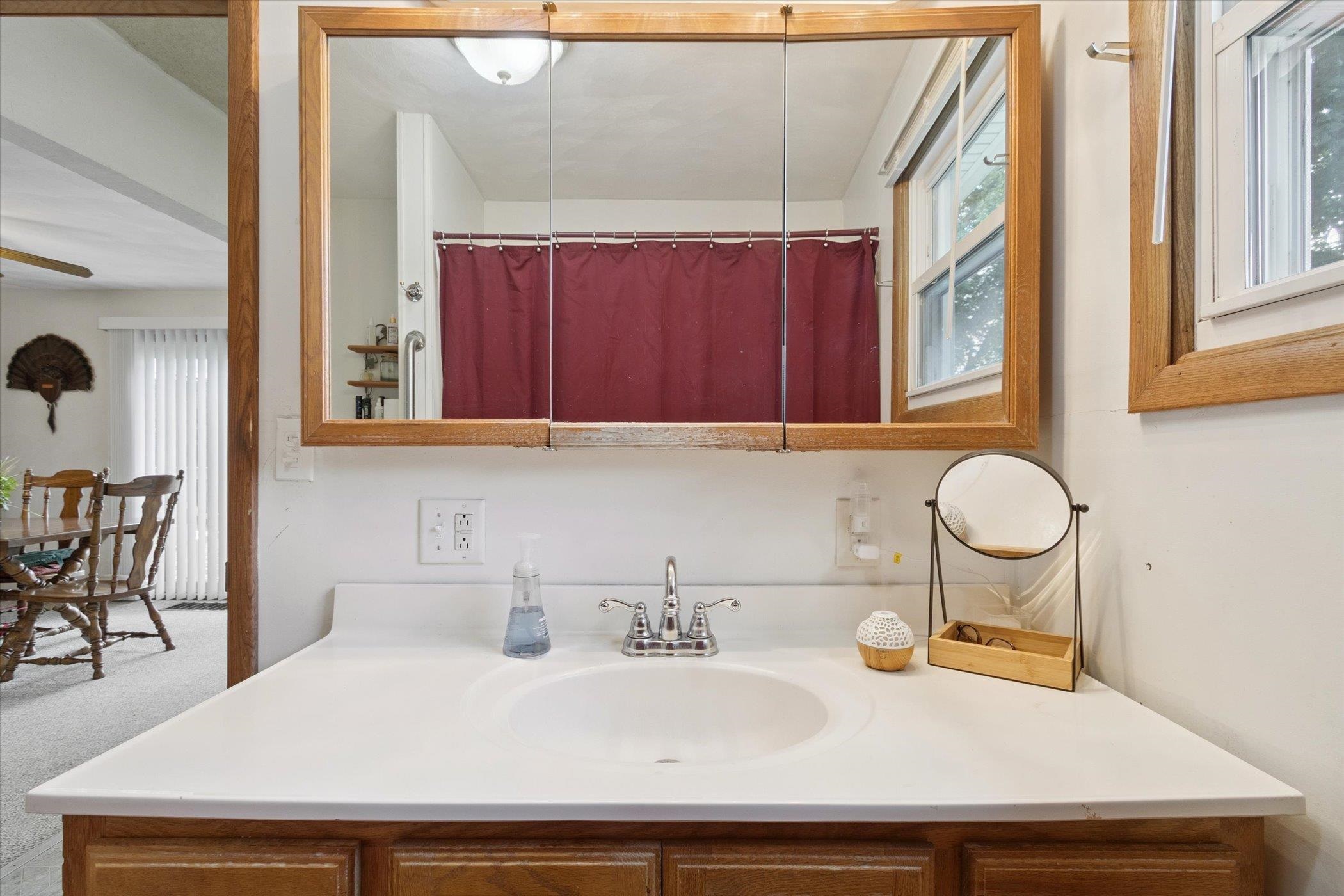 976 East Cedarville Road Freeport, IL 61032 - Photo 23 of 48 a bathroom with a sink and a mirror