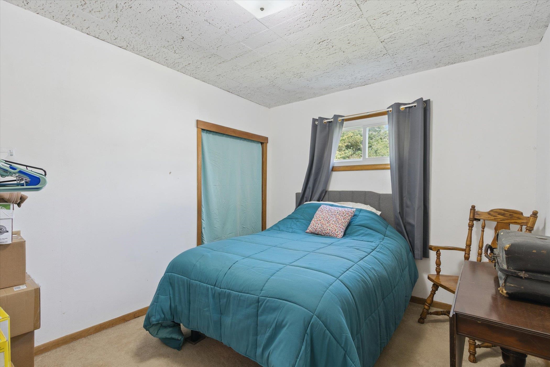 976 East Cedarville Road Freeport, IL 61032 - Photo 26 of 48 a bedroom with a bed and a dresser next to a window