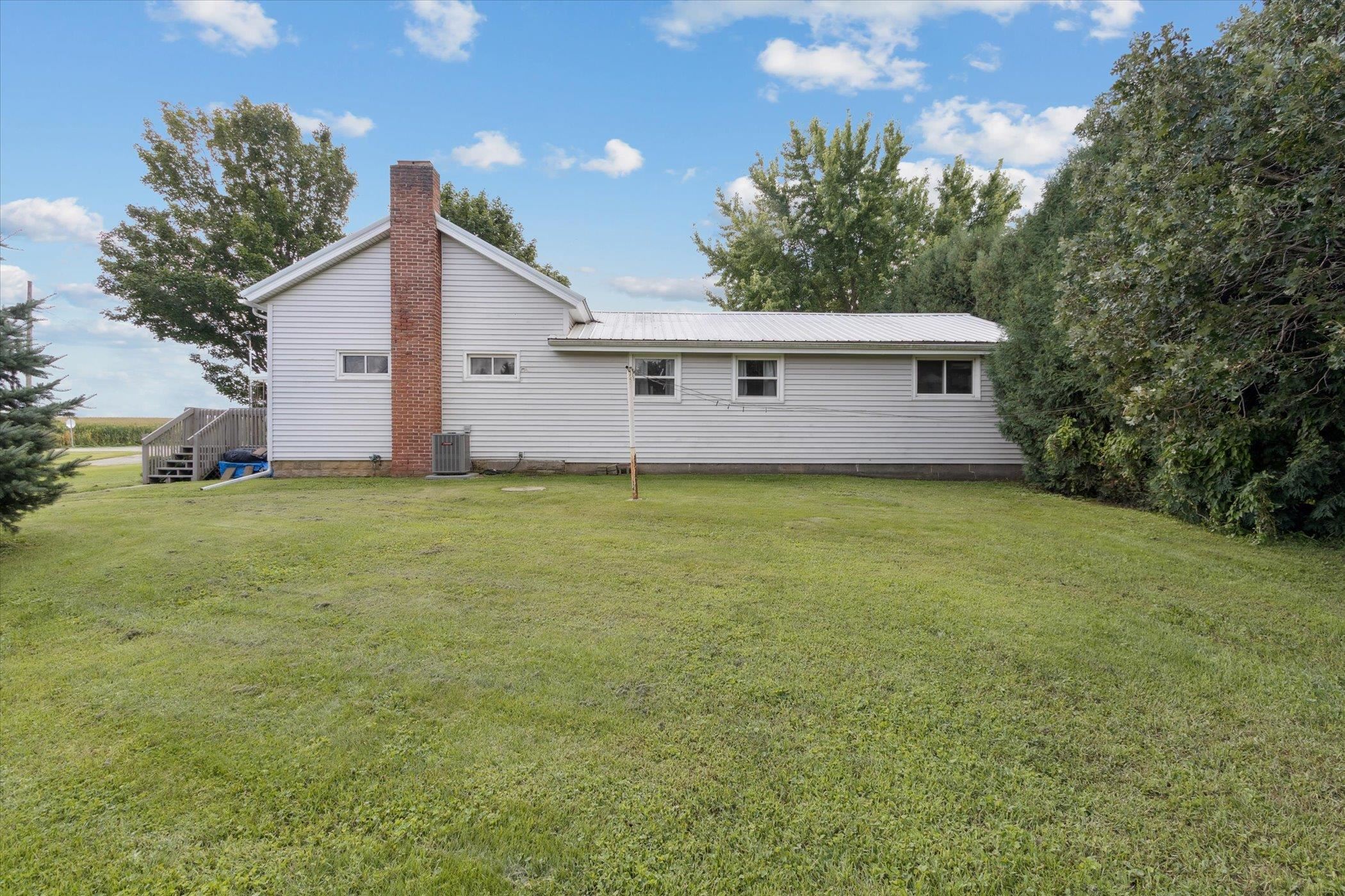 976 East Cedarville Road Freeport, IL 61032 - Photo 41 of 48 a view of a house with a yard