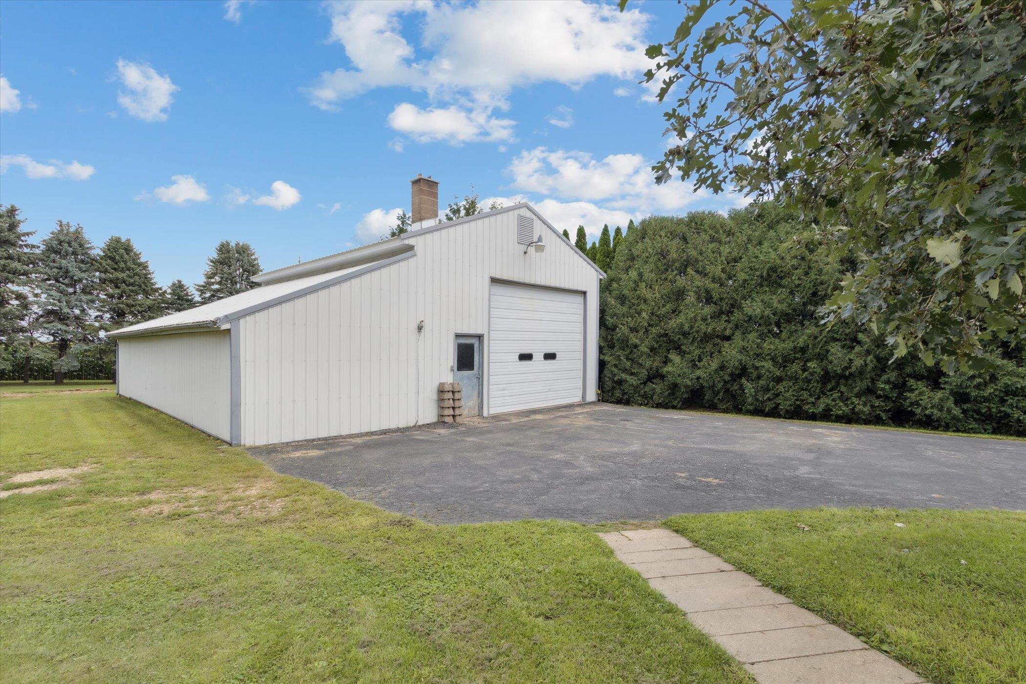 976 East Cedarville Road Freeport, IL 61032 - Photo 45 of 48 a view of a house with a yard and garage