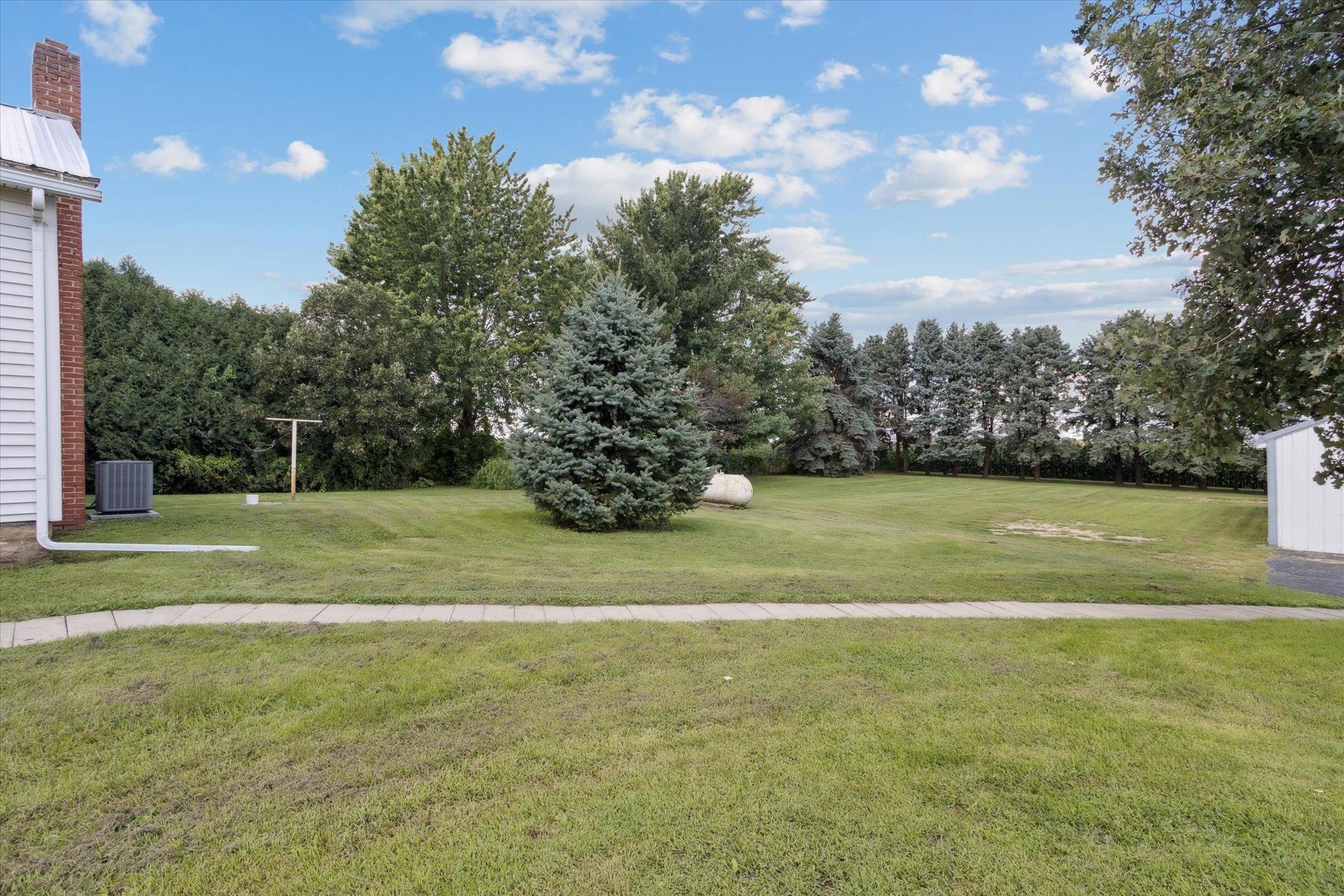 976 East Cedarville Road Freeport, IL 61032 - Photo 47 of 48 a view of a field with a trees in the background