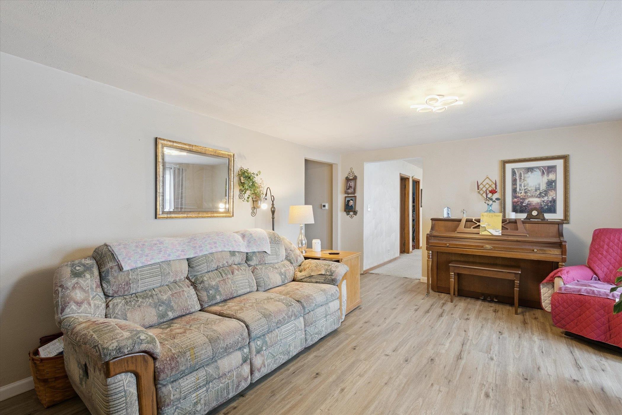 976 East Cedarville Road Freeport, IL 61032 - Photo 6 of 48 a living room with furniture and a wooden floor