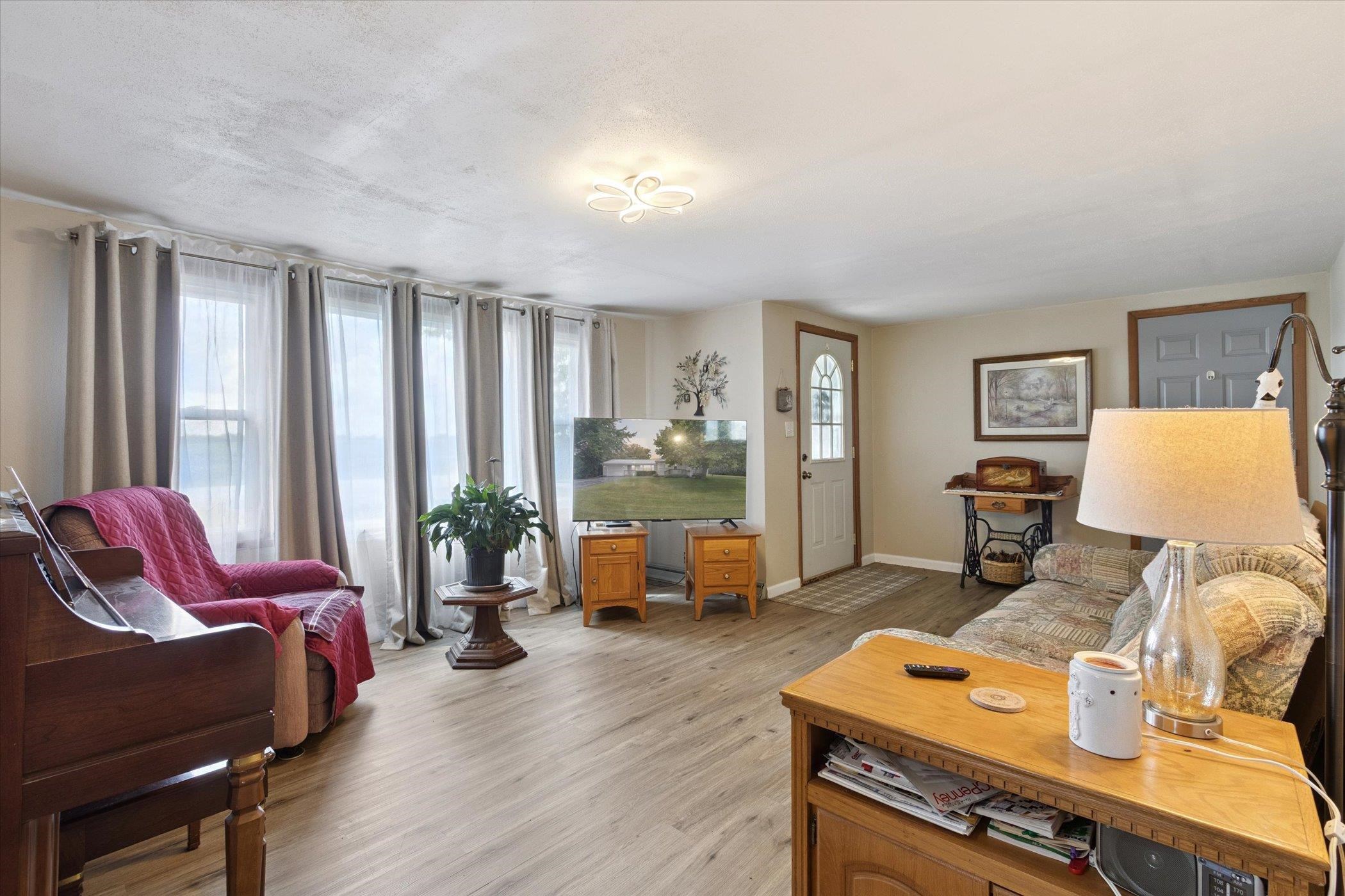 976 East Cedarville Road Freeport, IL 61032 - Photo 9 of 48 a living room with furniture and wooden floor
