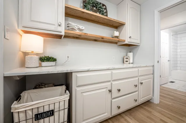 a living room with furniture and windows